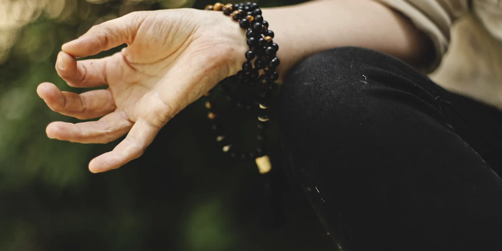 A person meditating outdoors
