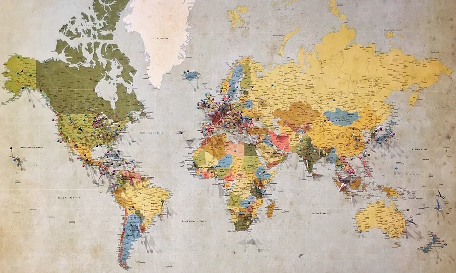 A world map marked with pins