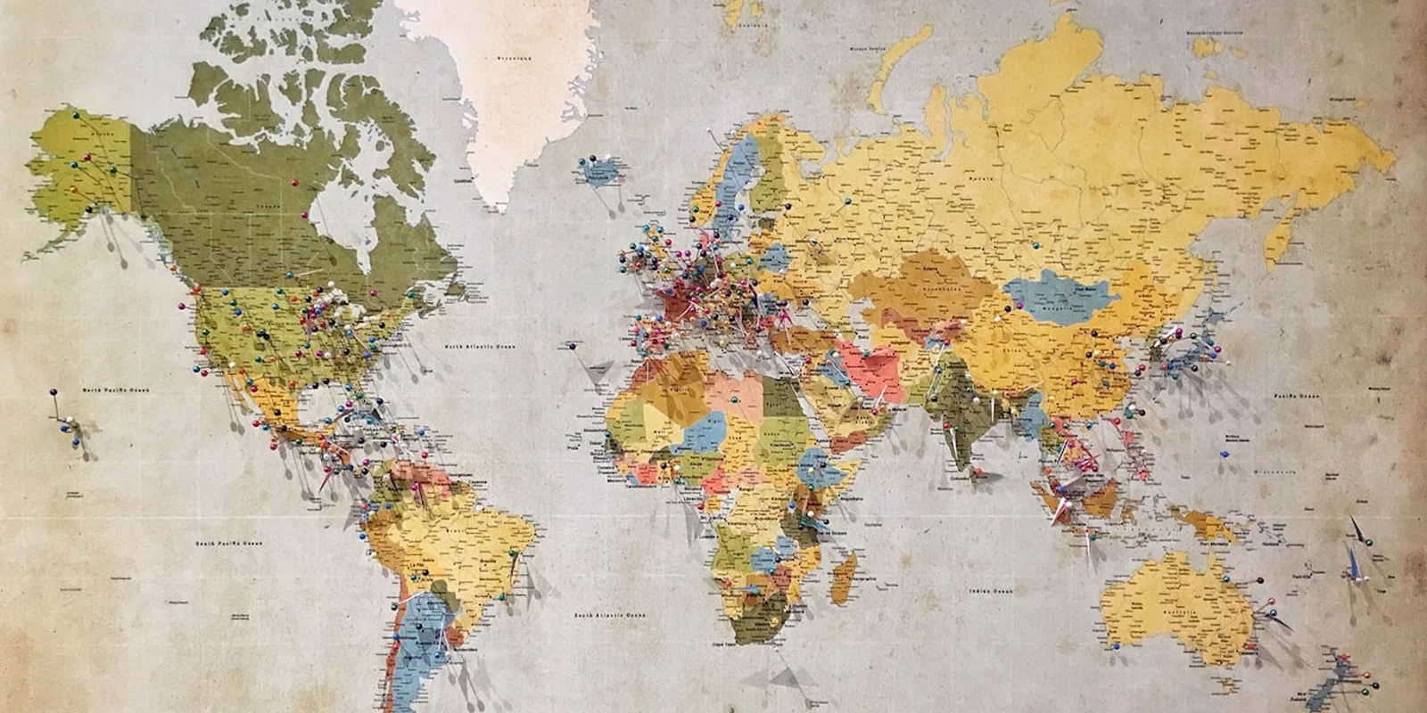 A world map marked with pins