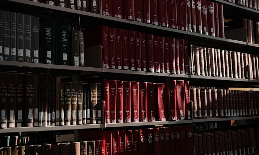 Rows of books on library shelves