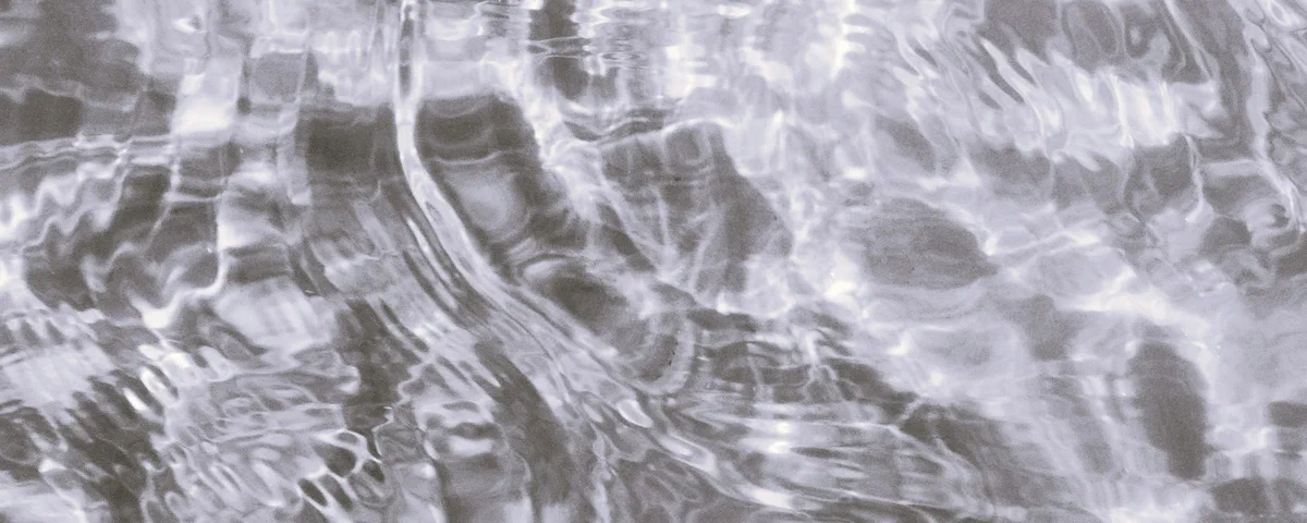 Gentle ripples moving across the surface of water